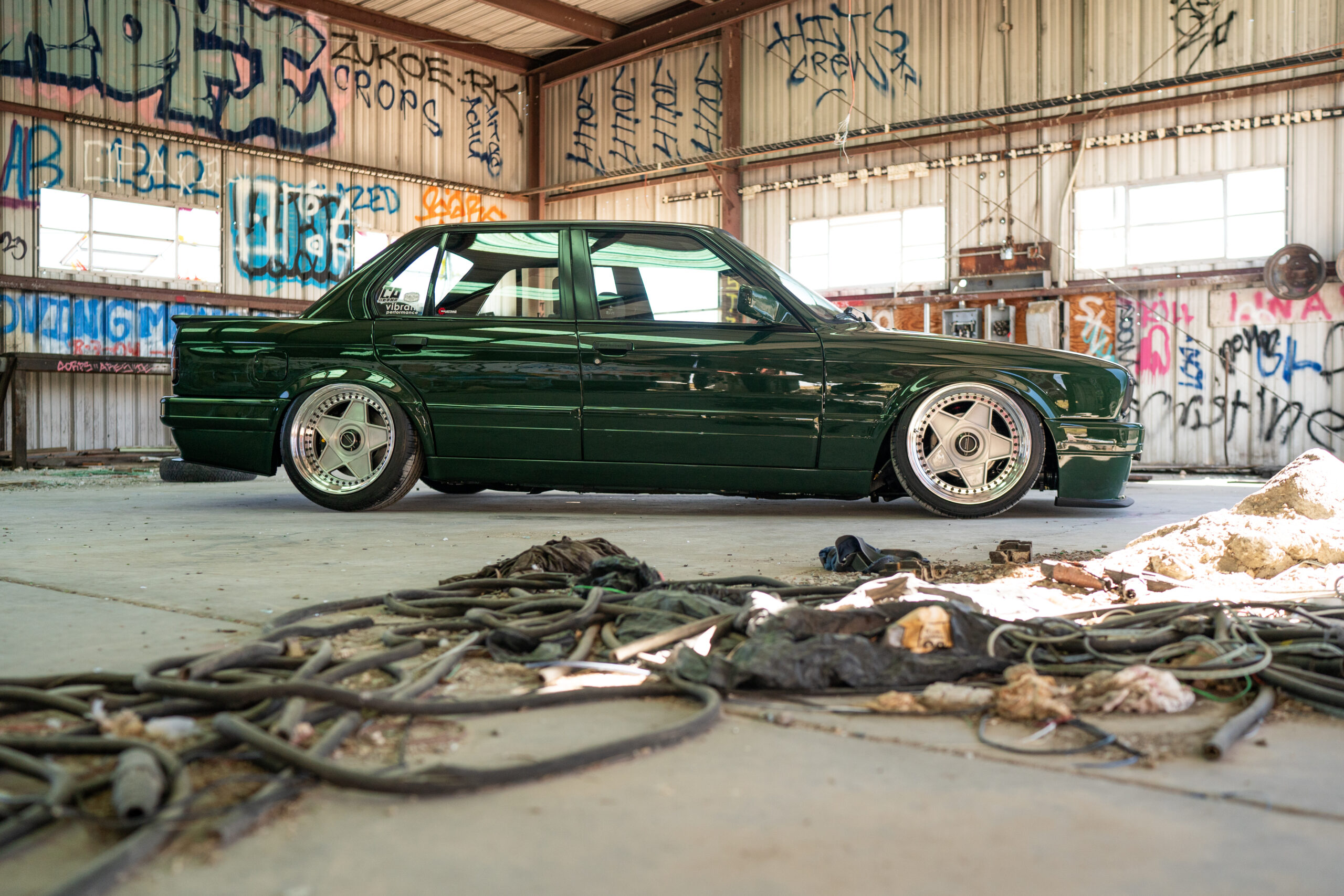 The Greenmaxhine BMW E30 Sedan by CAtuned