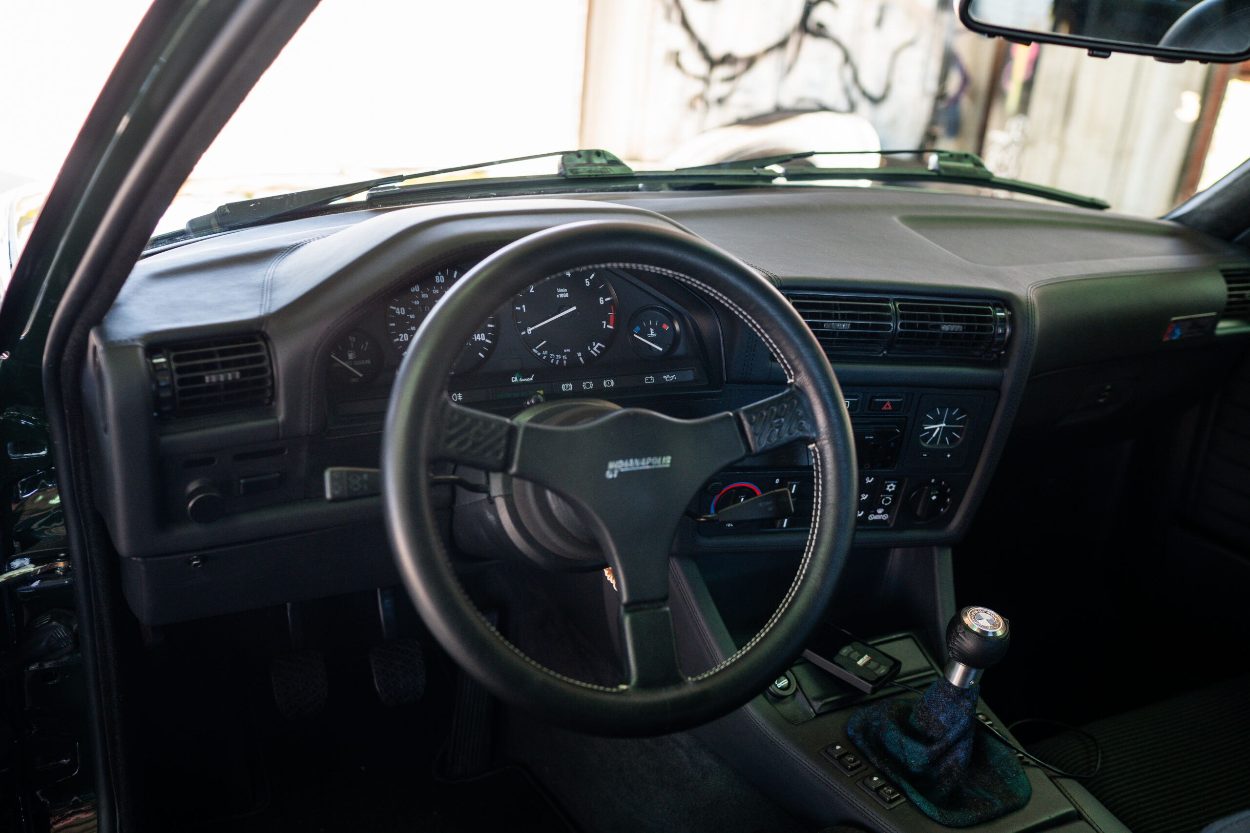 The Greenmaxhine BMW E30 Sedan by CAtuned