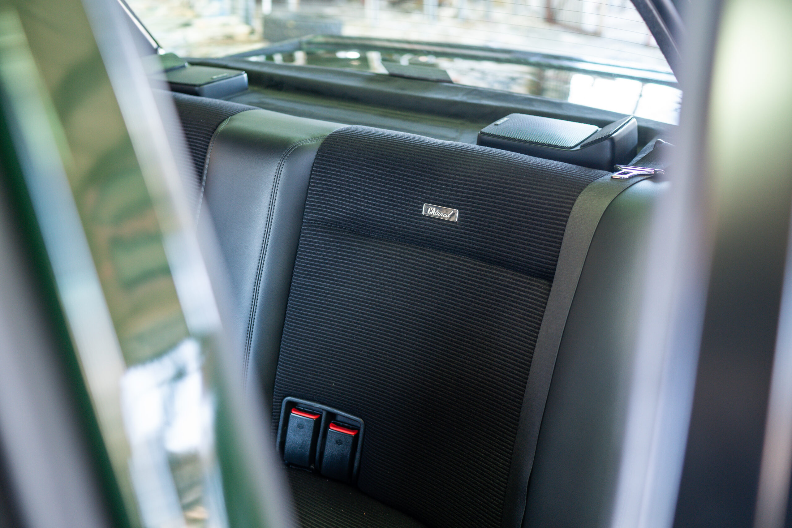 The Greenmaxhine BMW E30 Sedan by CAtuned