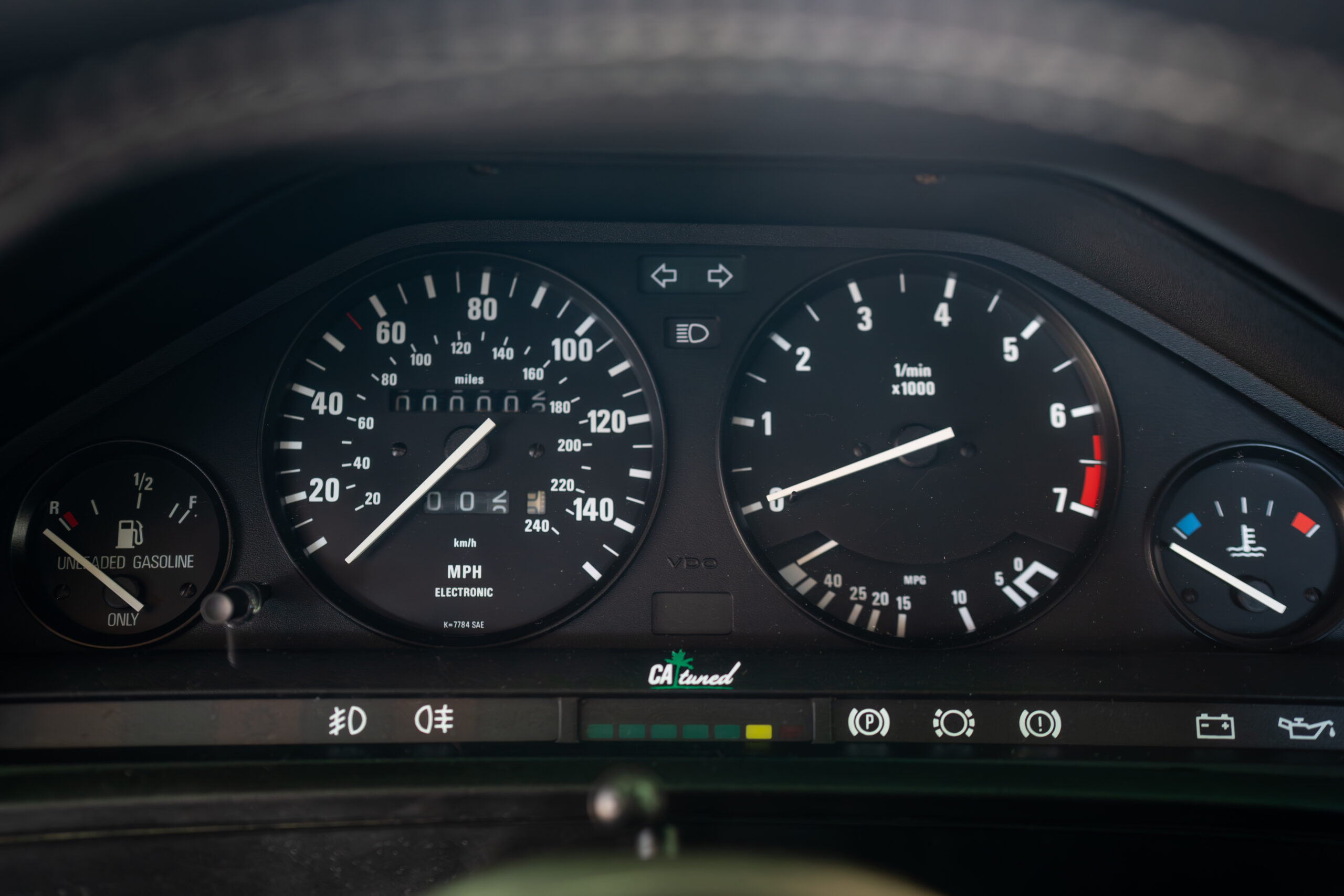 The Greenmaxhine BMW E30 Sedan by CAtuned