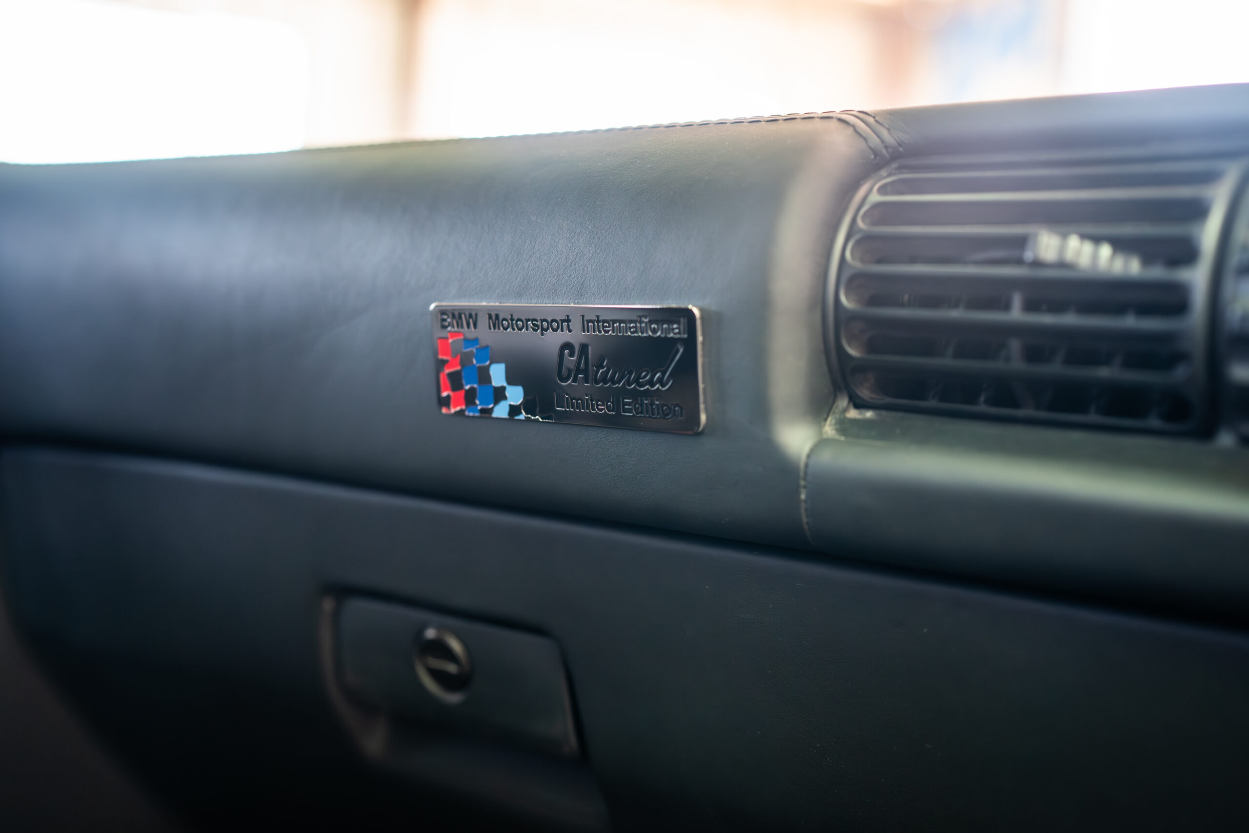 The Greenmaxhine BMW E30 Sedan by CAtuned