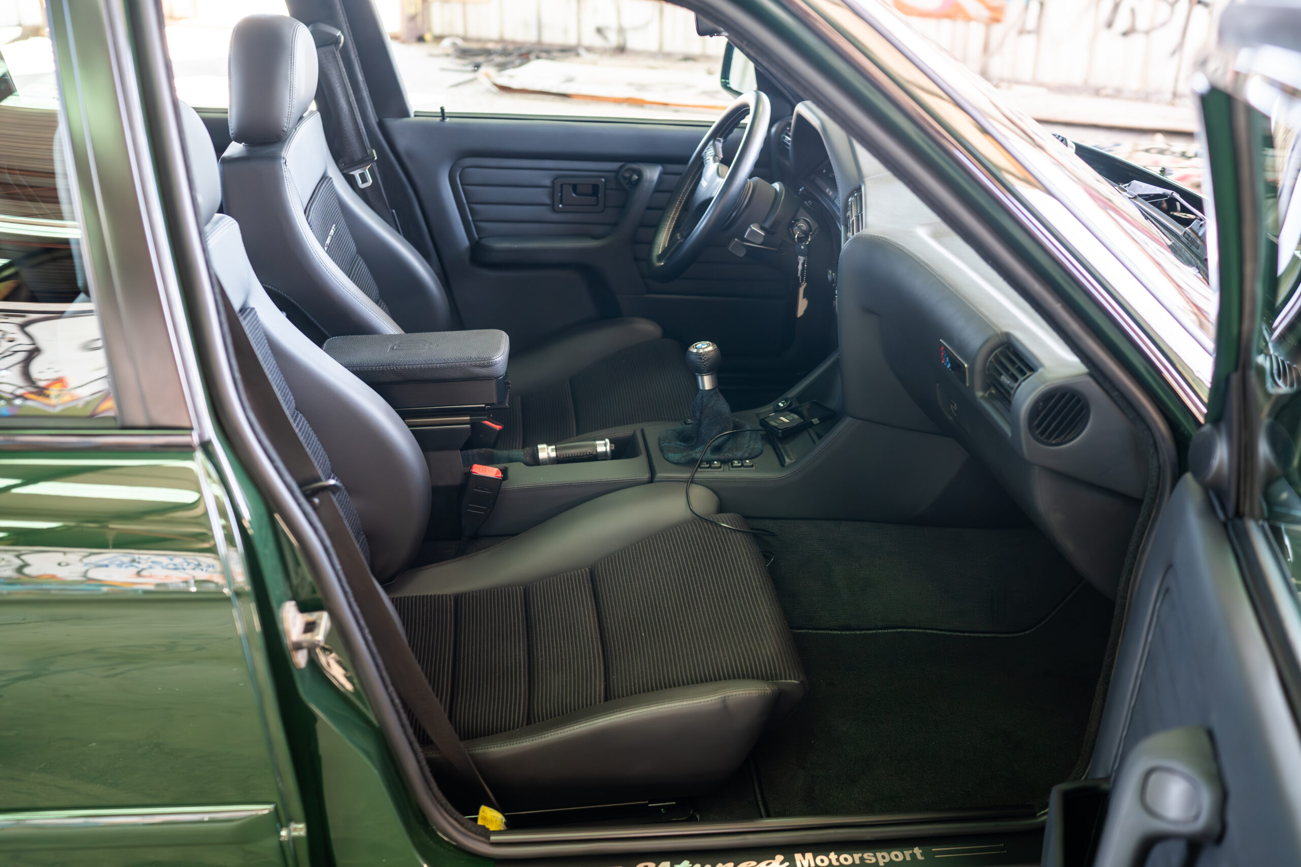 The Greenmaxhine BMW E30 Sedan by CAtuned
